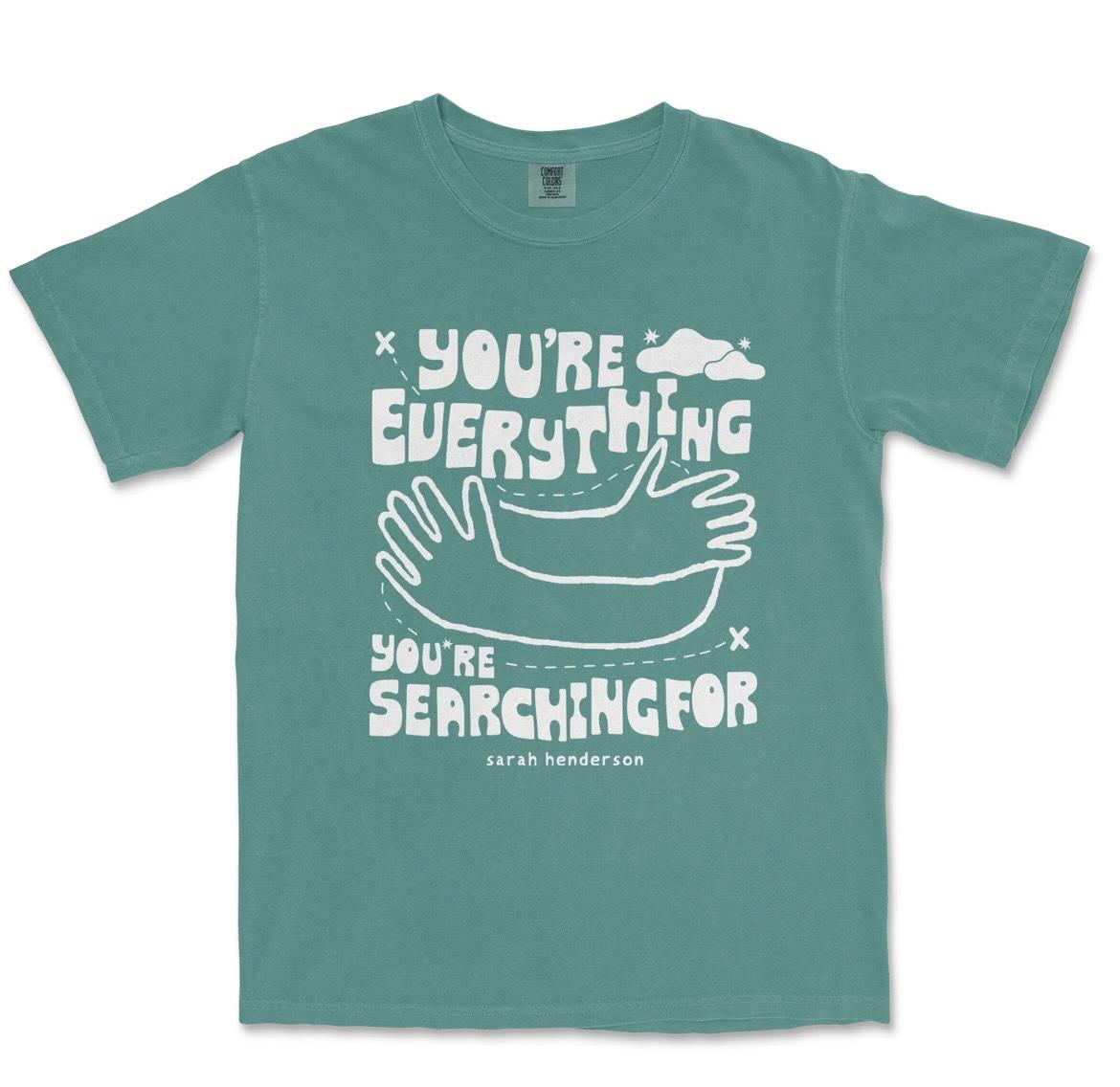 Green Comfort Colors tee screen-printed with "You're Everything You're Searching For" in white, above a drawing of two arms in a hug